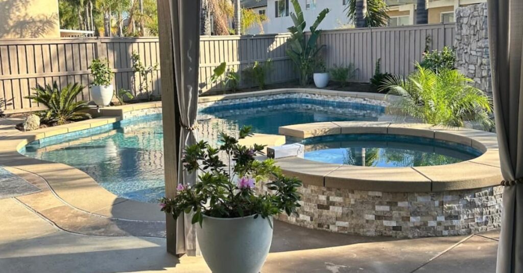 plant in pot, raised spa, pool, fence, San Diego pool builders