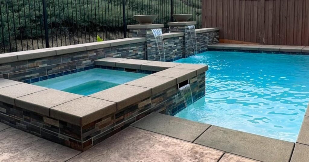 custom design pool and spa, retaining wall and waterfalls in 2 columns