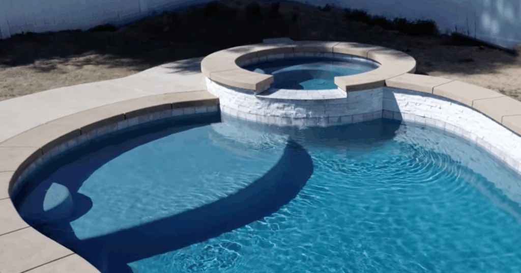 custom pool and spa design combination with tanning ledge