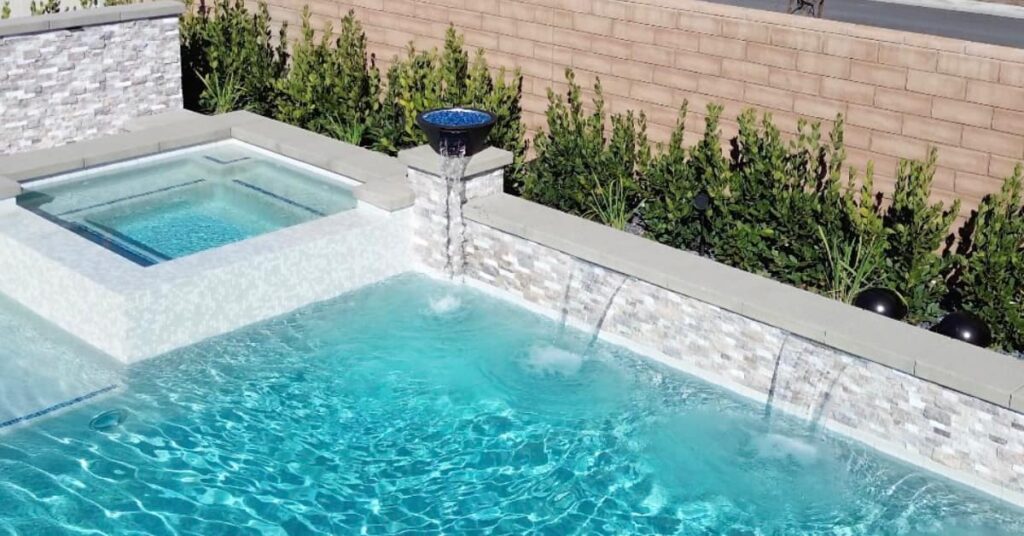 pool, spa, stone wall, by Majestic Pool Construction - Premier Pool Builder in Riverside, CA