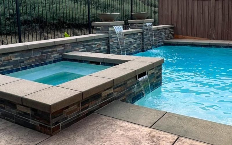 custom design pool and spa, retaining wall and waterfalls in 2 columns
